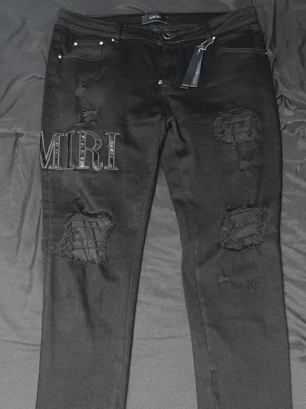 AMIRI Black Slim Distressed Jeans with Embroidered MIRI Patch
